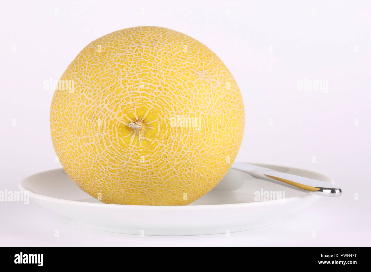 Melon on a plate with cutlery Stock Photo