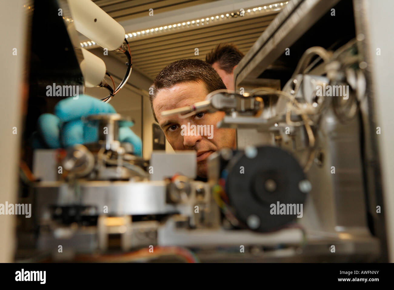 Scientist at the electron microscope IB Cross Bi, Nanostructure Service Laboratory, Karlsruhe university, Baden-Wuerttemberg, G Stock Photo