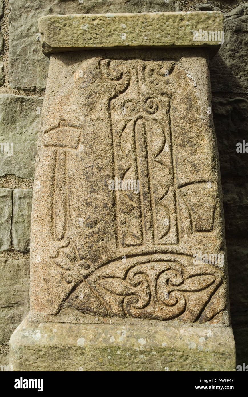 dh Pictish art carving ABERNETHY PERTHSHIRE SCOTLAND On stone at foot of 11st century Irish celtic round tower pict symbol Stock Photo