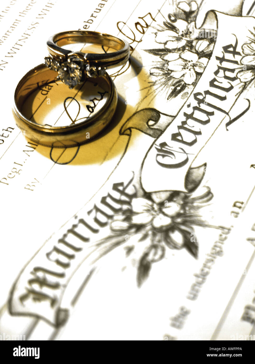 Wedding rings on marriage certificate Stock Photo - Alamy