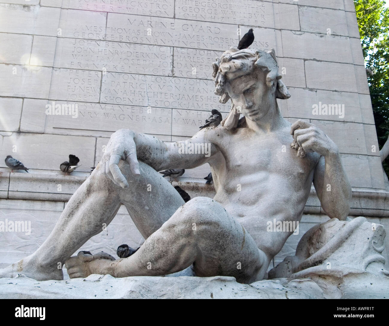 A stone statue on the side of the Maine Monument, on Columbus Circle at the entrance to Central Park, New York City USA Stock Photo