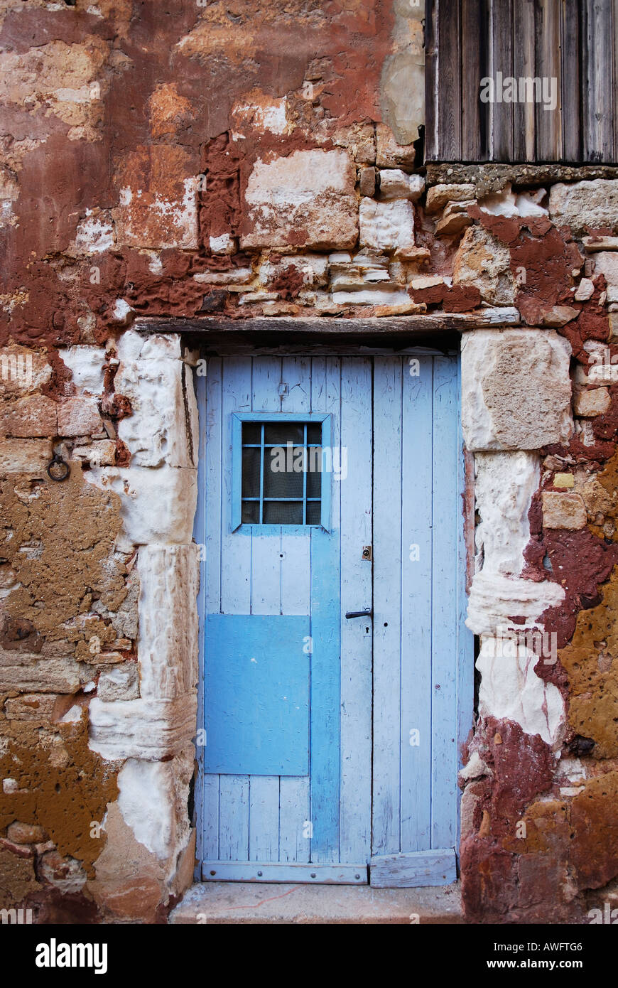 light blue door in red wall in Roussillon, Provence, France Stock Photo -  Alamy