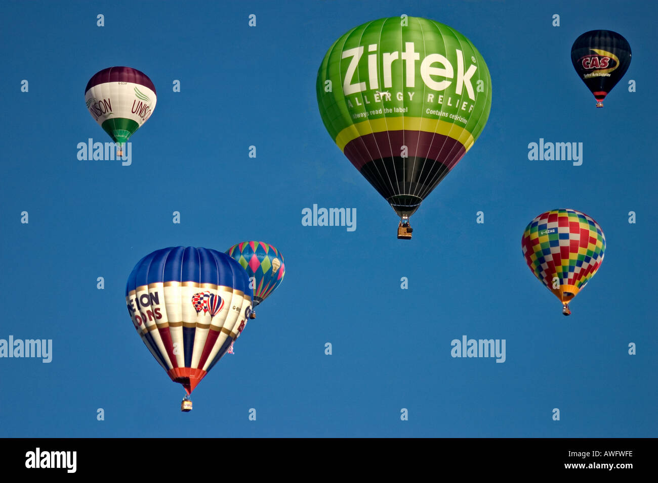 Balloons flying in blue sky Stock Photo - Alamy
