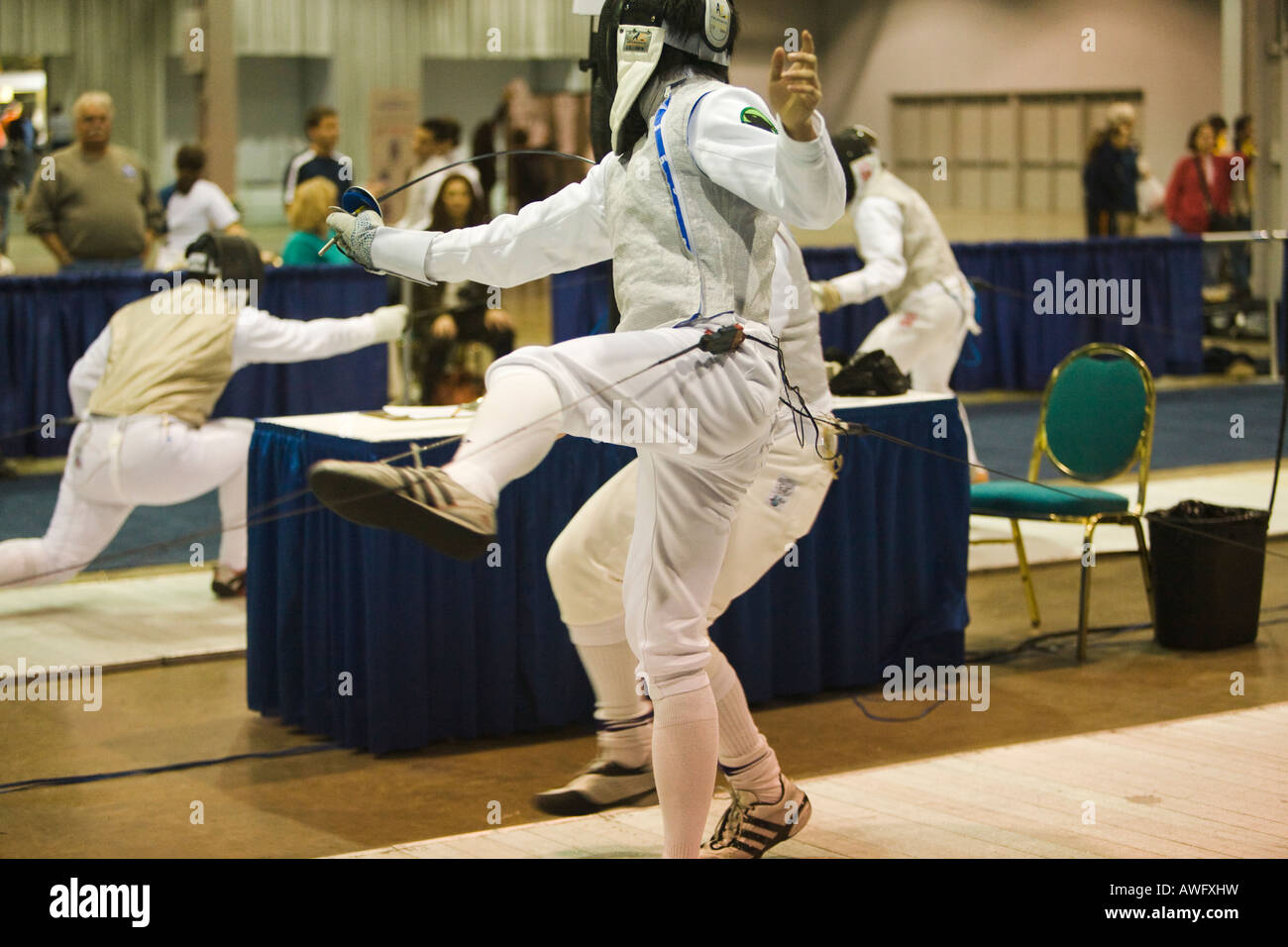 SPORTS Fencing competition bout male foil competitors on strip during