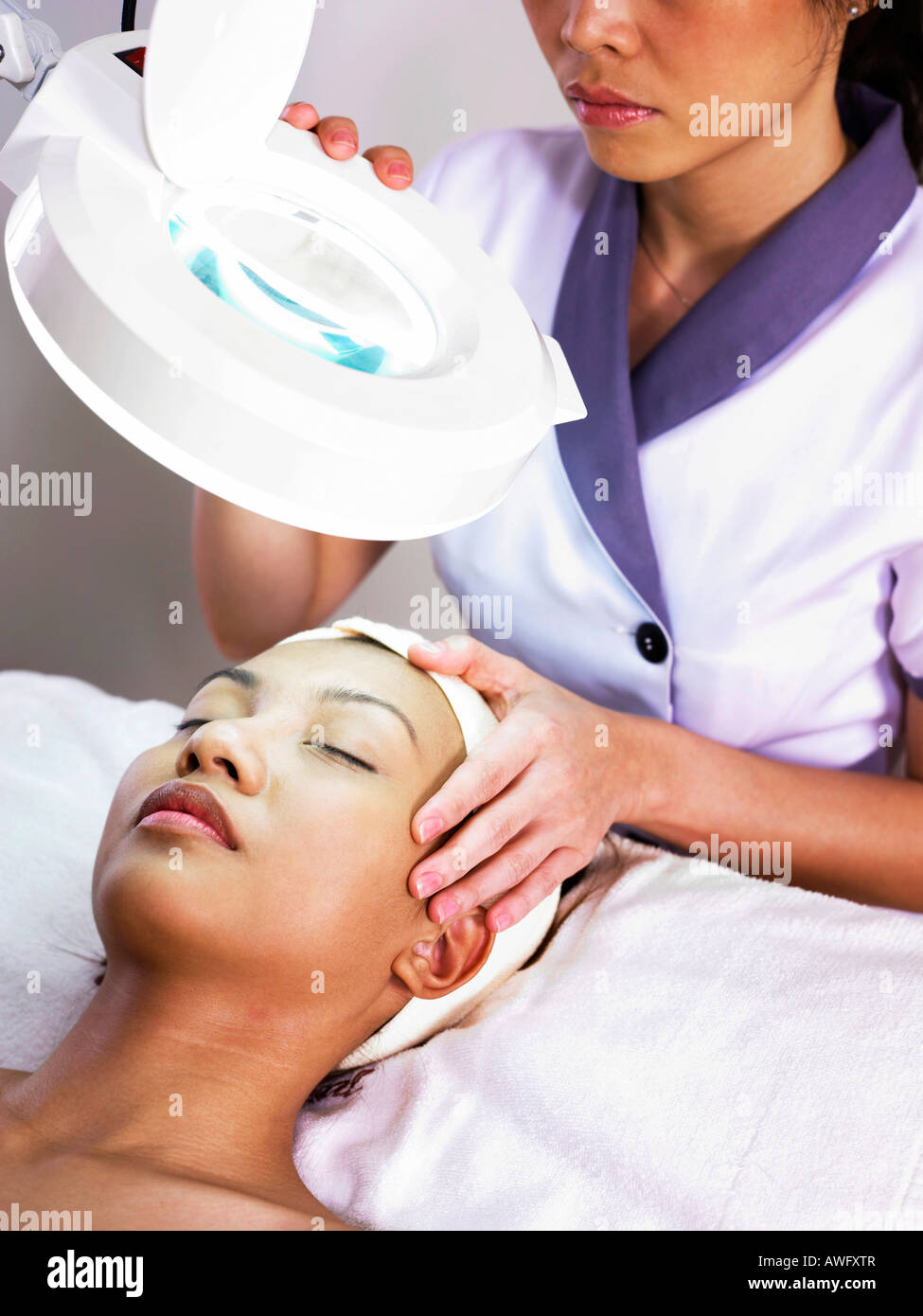 woman receiving spa facial treatment Stock Photo Alamy