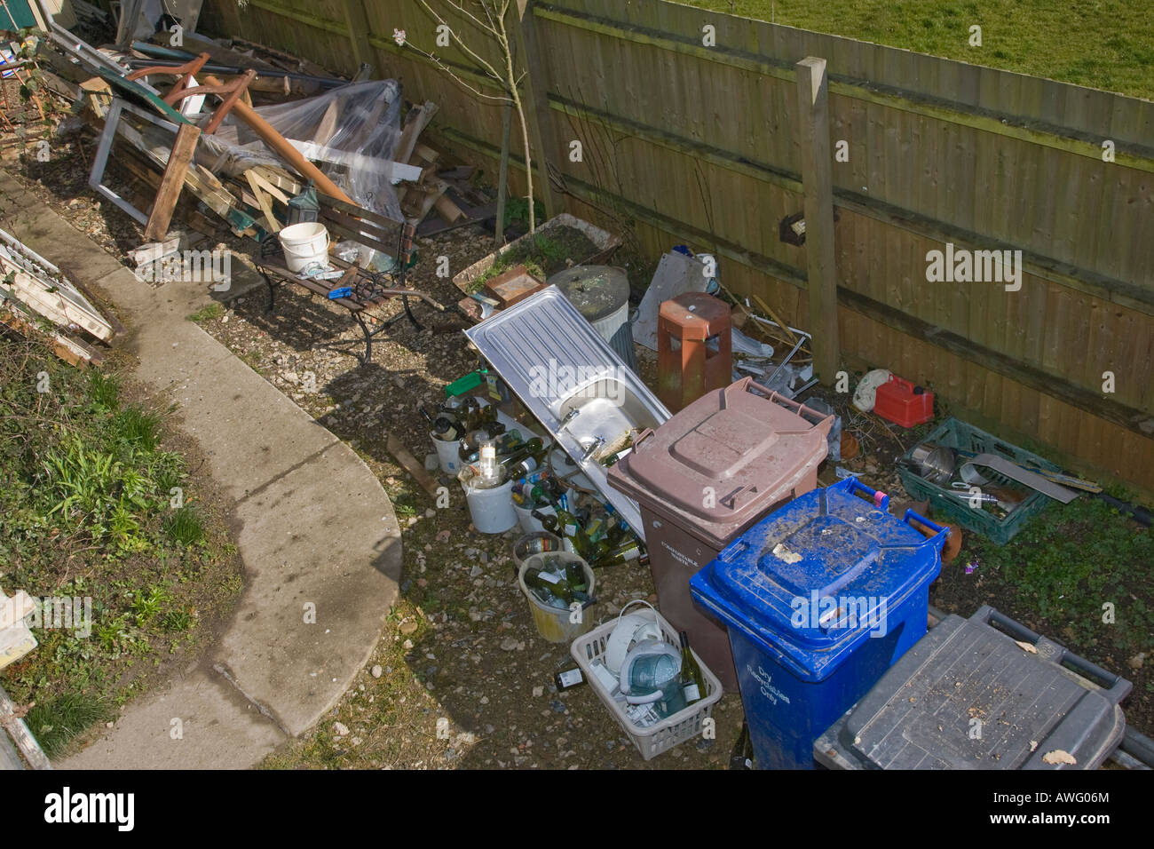 wheelie bins in untidy backyard Stock Photo