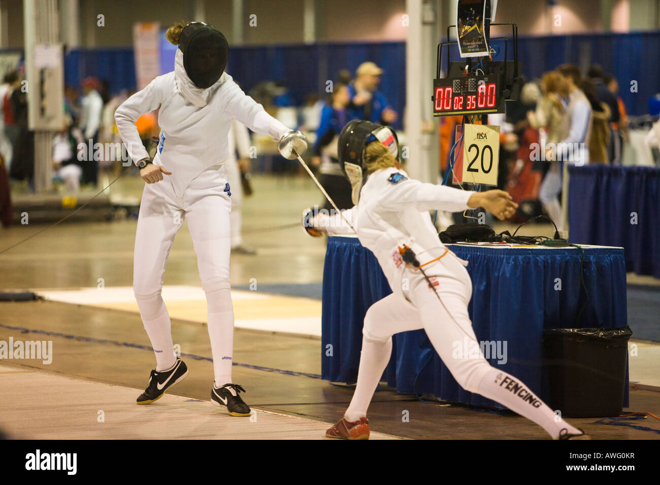 SPORTS Fencing competition epee weapon women in bout on strip lunging