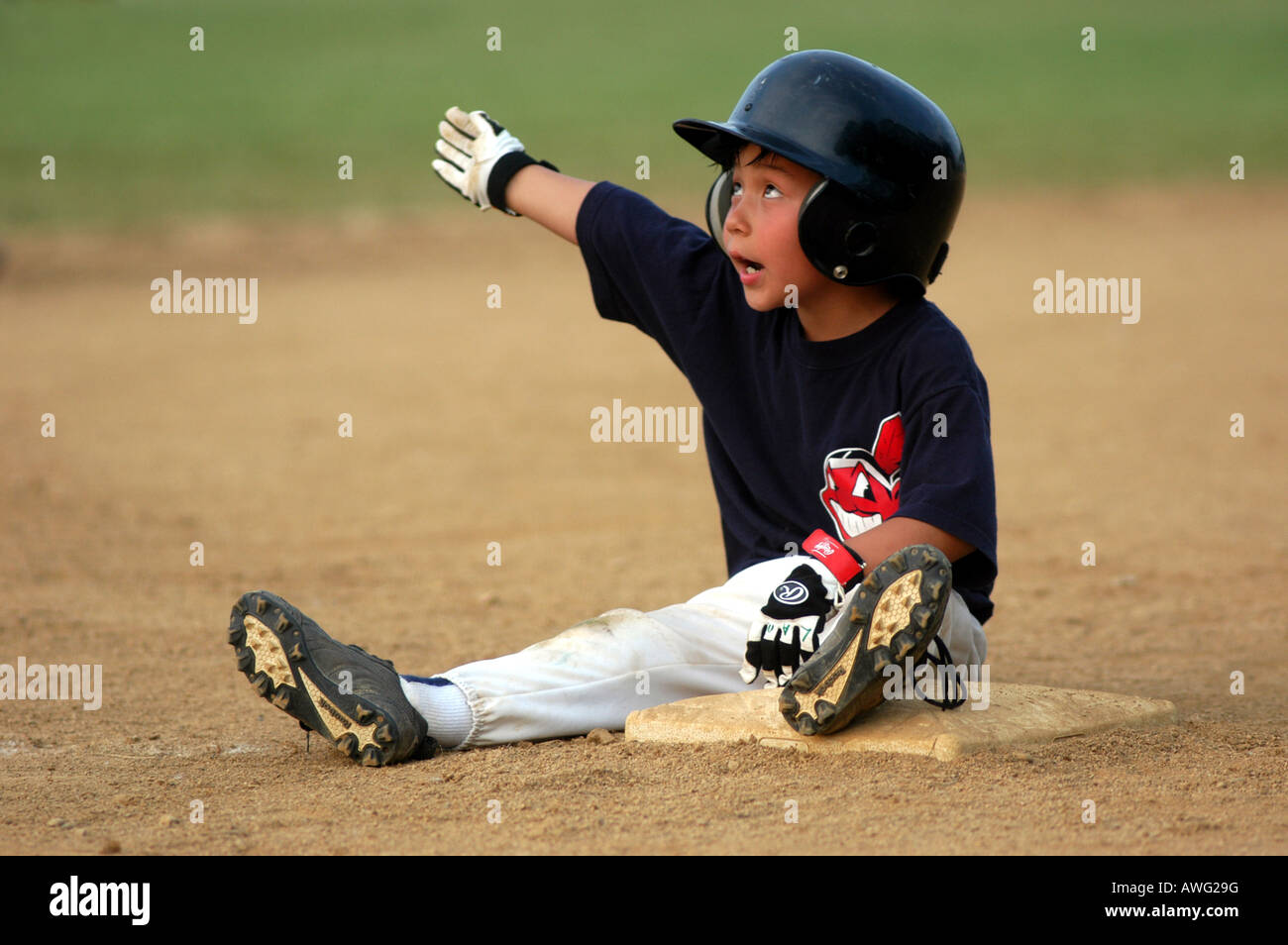 Five year argues with umpire while sitting on third base after called out baseball Ohio USA Stock Photo