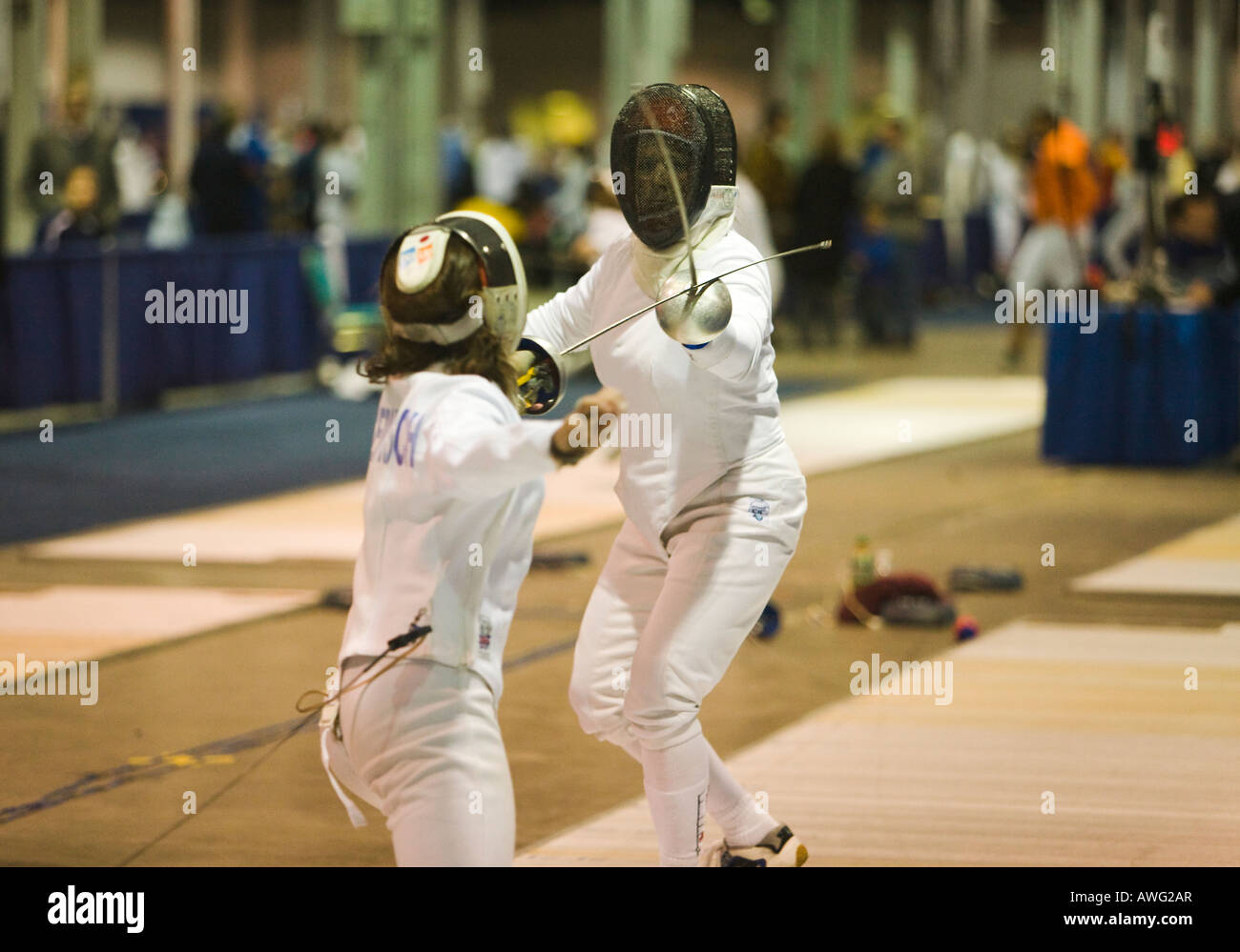 SPORTS Fencing competition two women competing on strip using epee