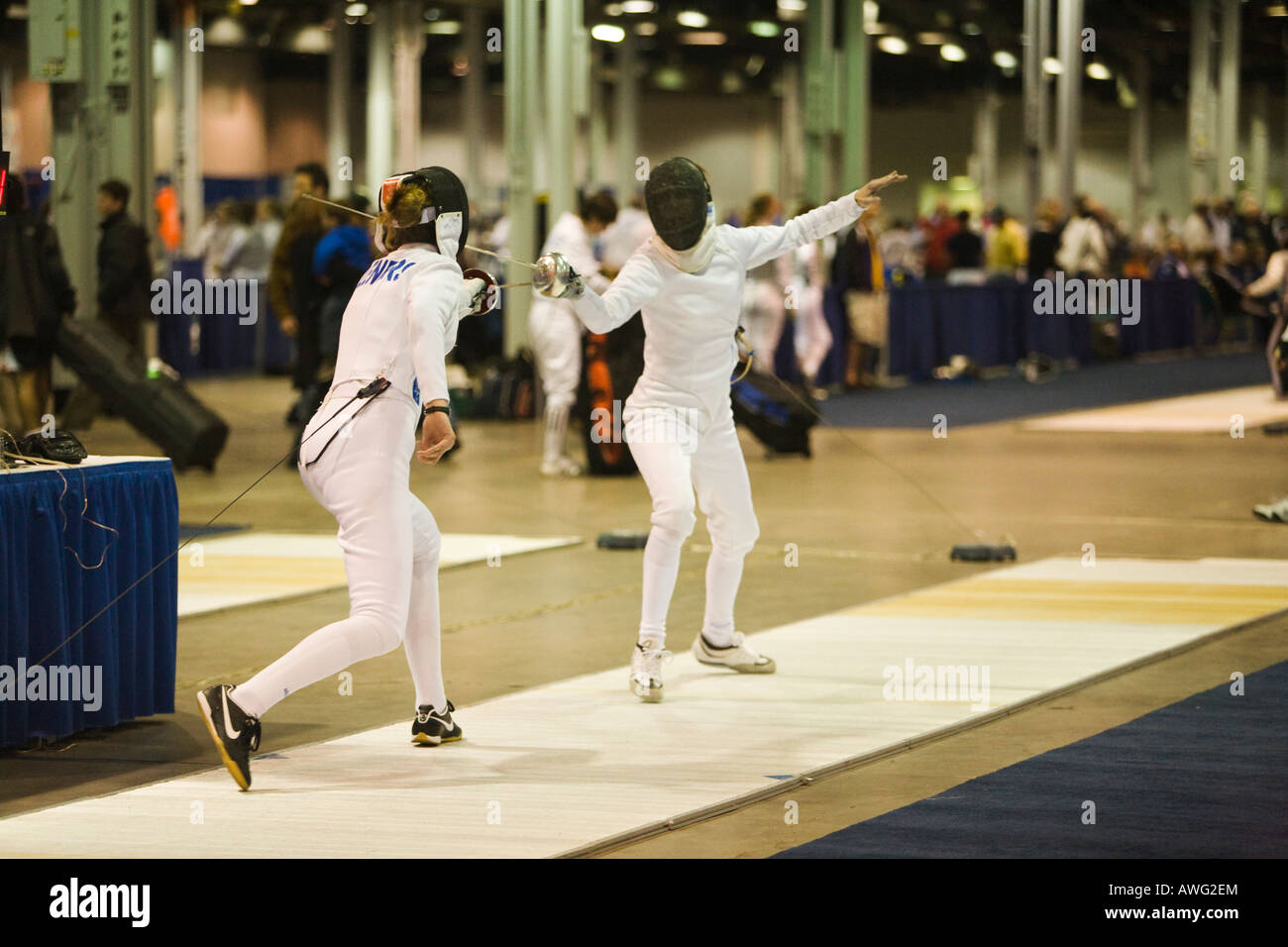 SPORTS Fencing competition two women competing on strip using epee