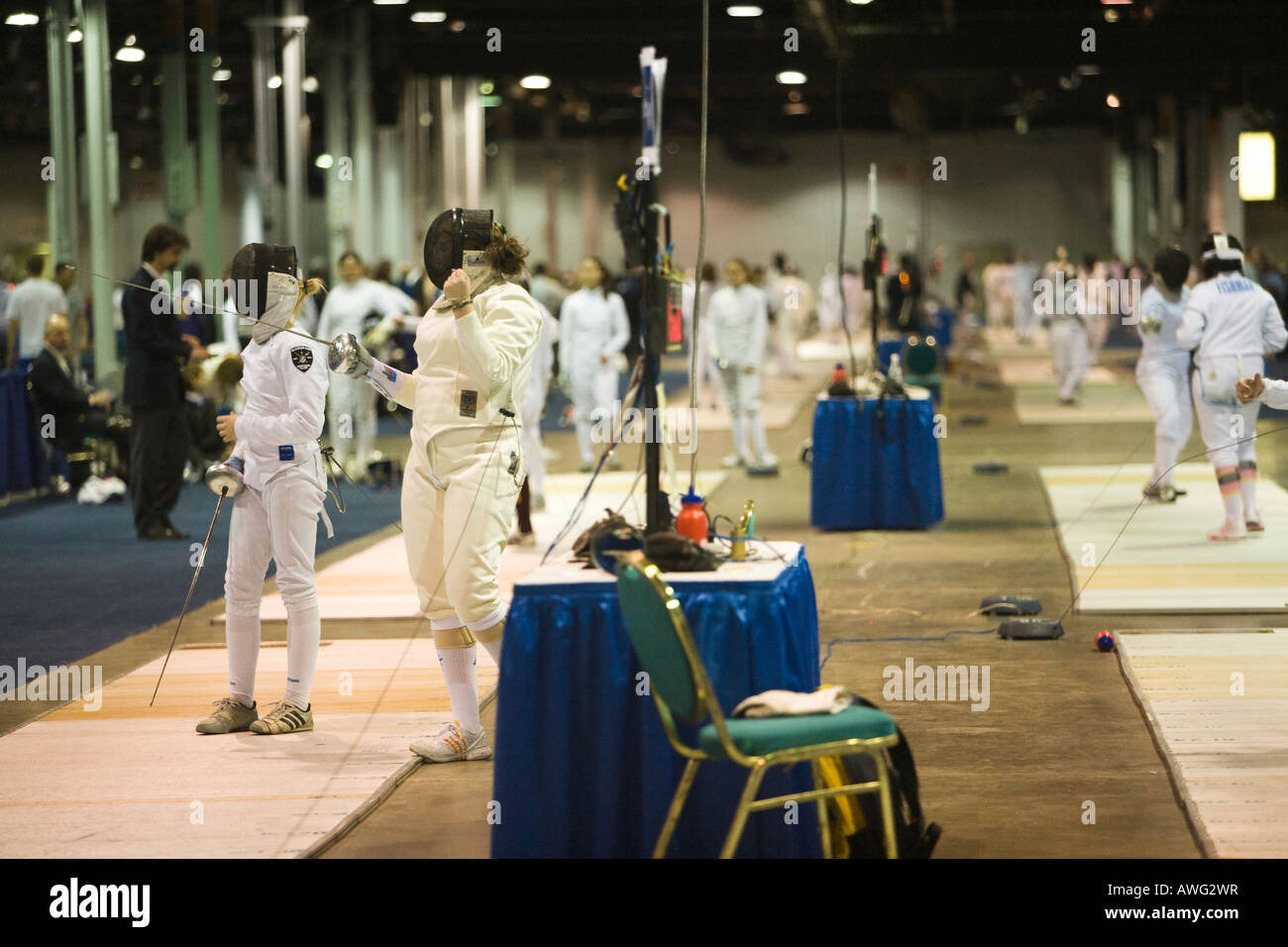 SPORTS Fencing competition women competitors on multiple strips in