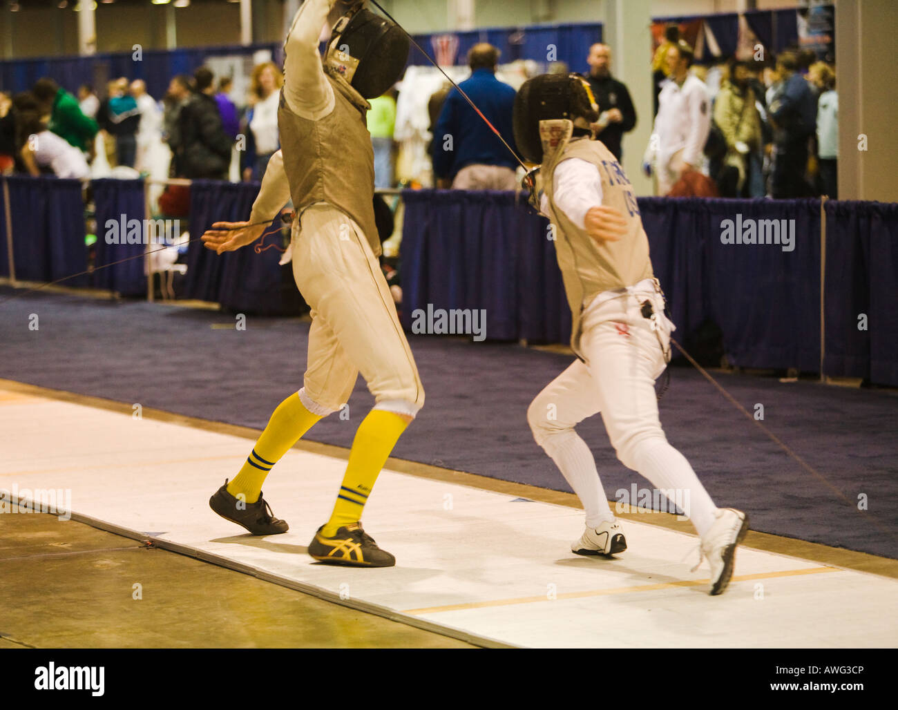 SPORTS Fencing competition bout male foil competitors on strip during