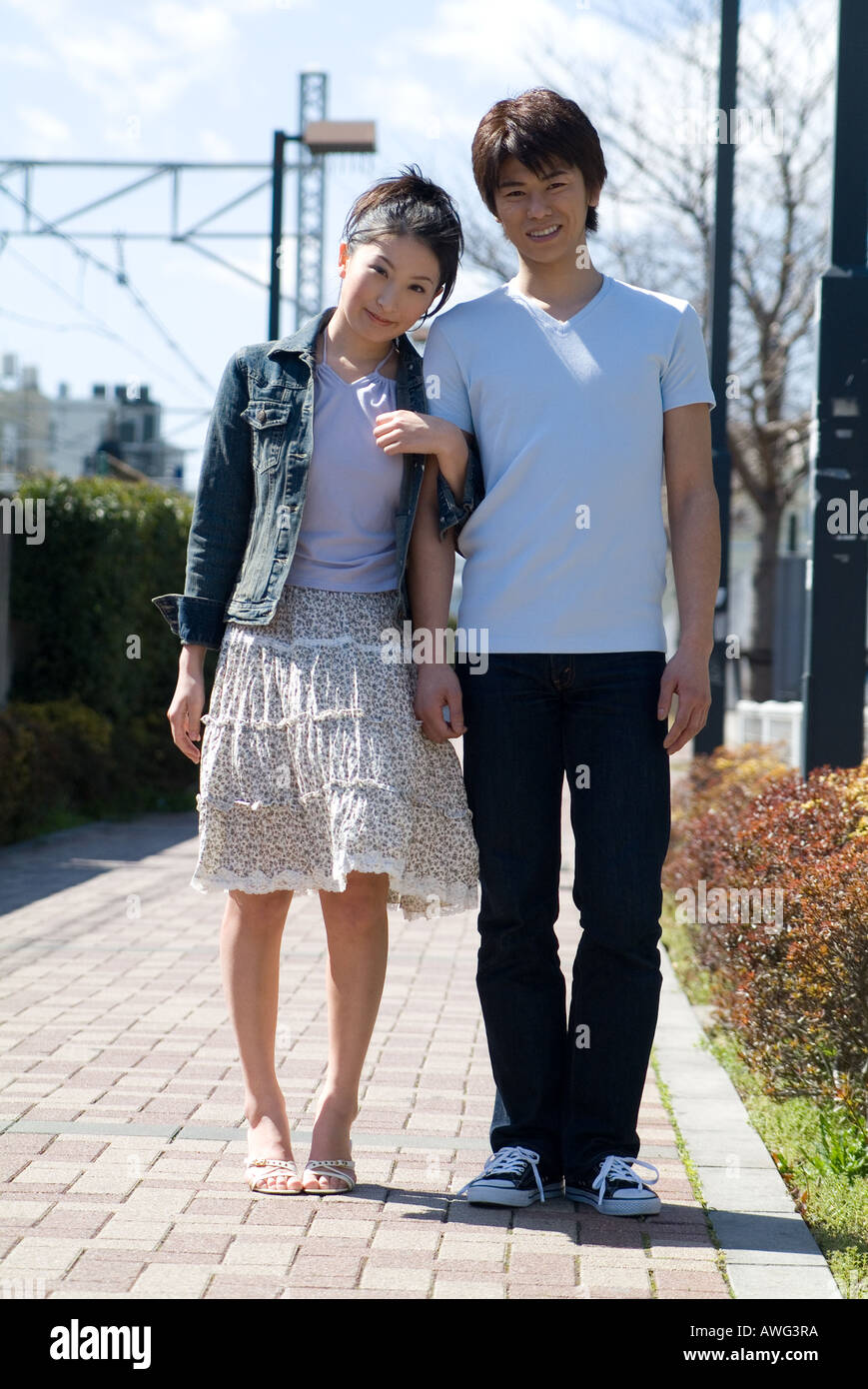 Happy asian couple standing hi-res stock photography and images - Alamy