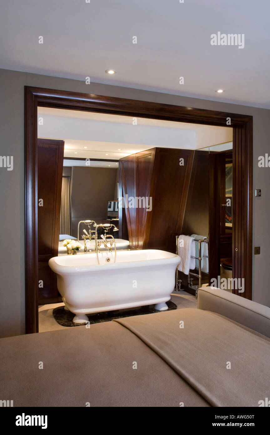 en-suite bathroom seen from bedroom in a London apartment, interior design by Keech Green Stock Photo