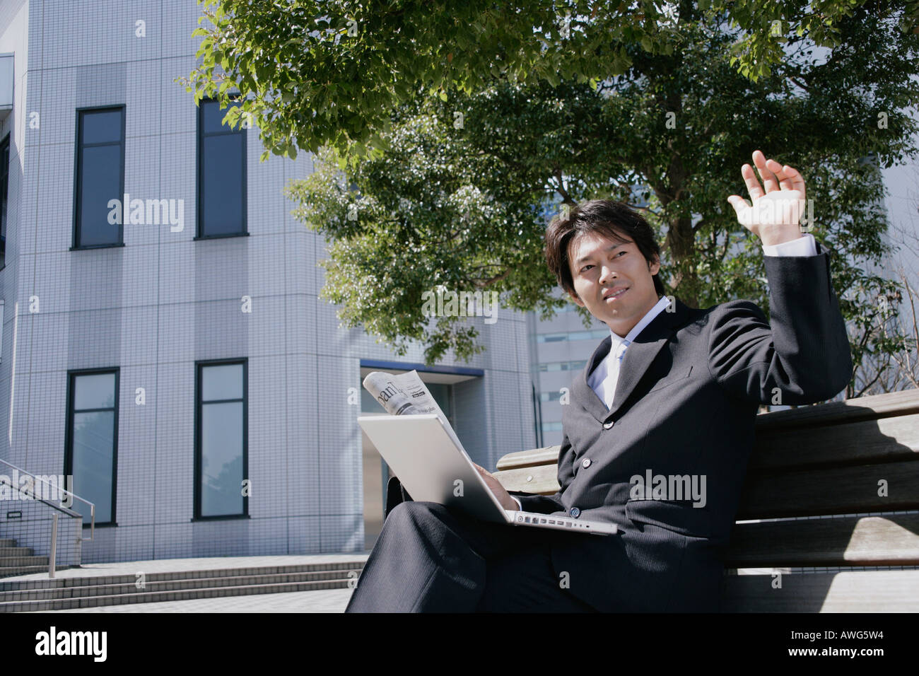 Businessman raising hand hi-res stock photography and images - Alamy