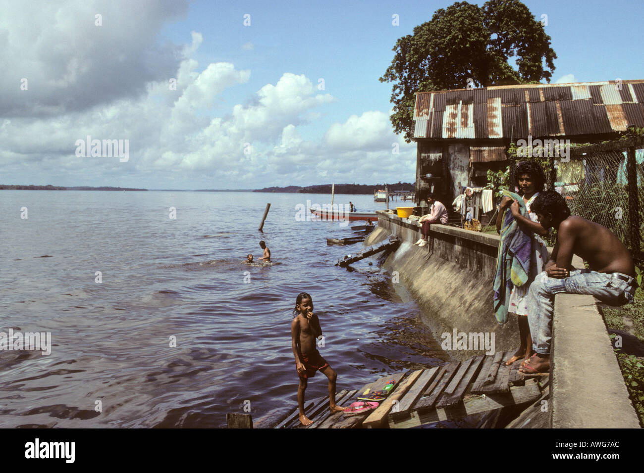People bathing in Essequibo River Bartica Guyana Stock Photo