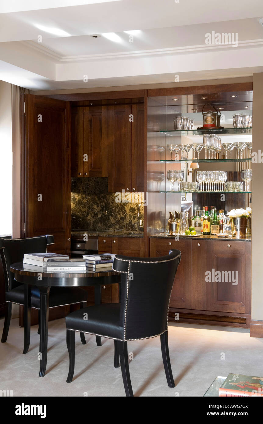 Small Dining Table In Front Of Built In Cabinet In A London Stock