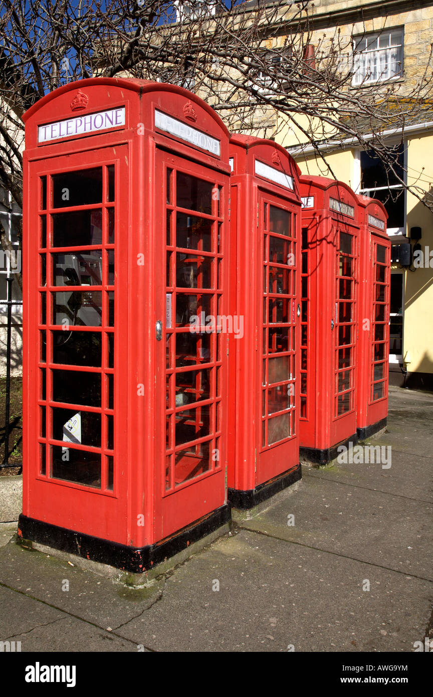 A row of 4 red phone British boxes in Truro, Cornwall UK. Stock Photo