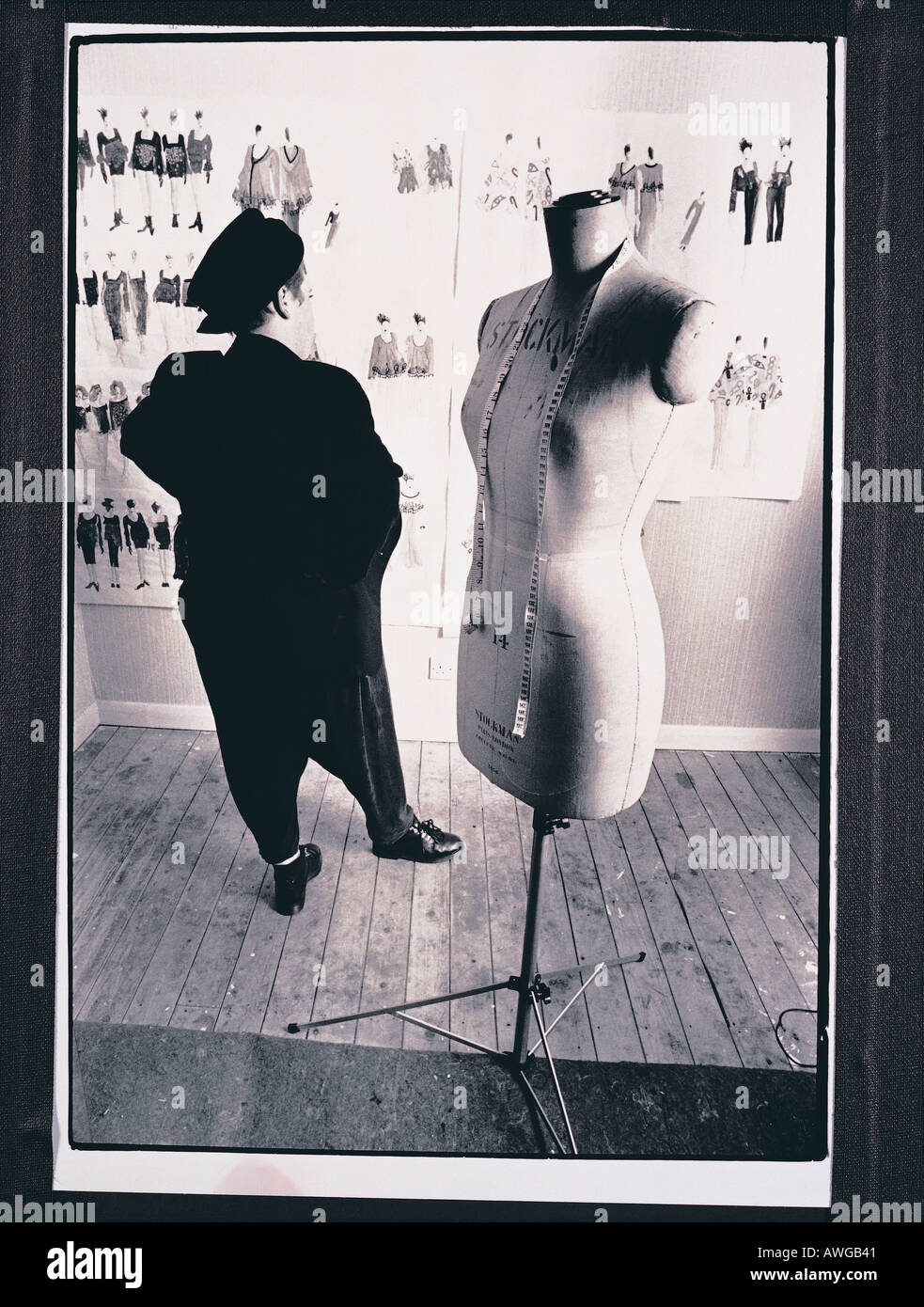 A fashion designer with a dress dummy Stock Photo - Alamy
