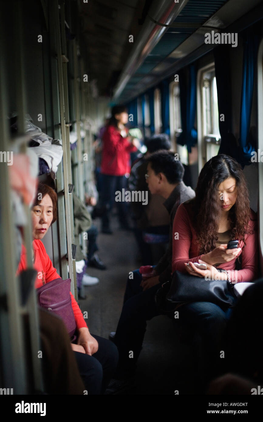 Passengers in the corridor of a train, People's Republic of China Stock Photo