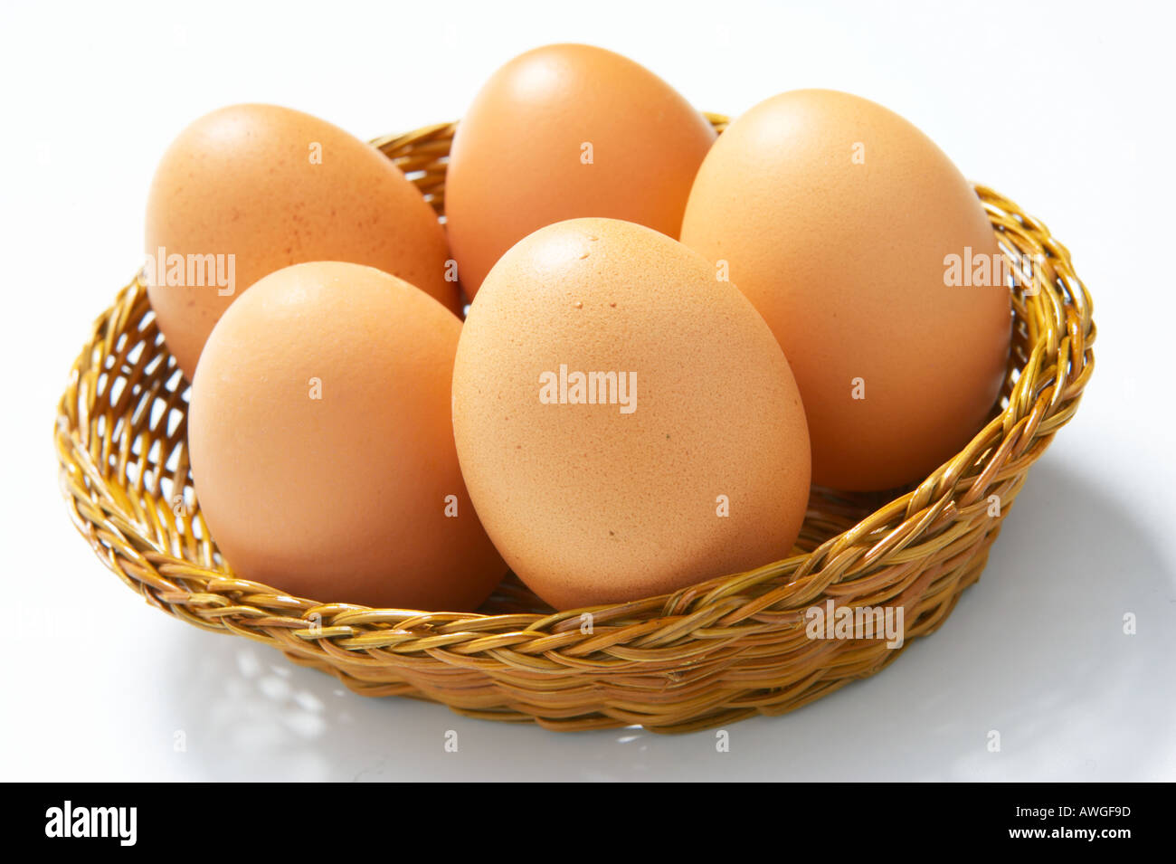 Eggs in one basket simple concept Stock Photo Alamy
