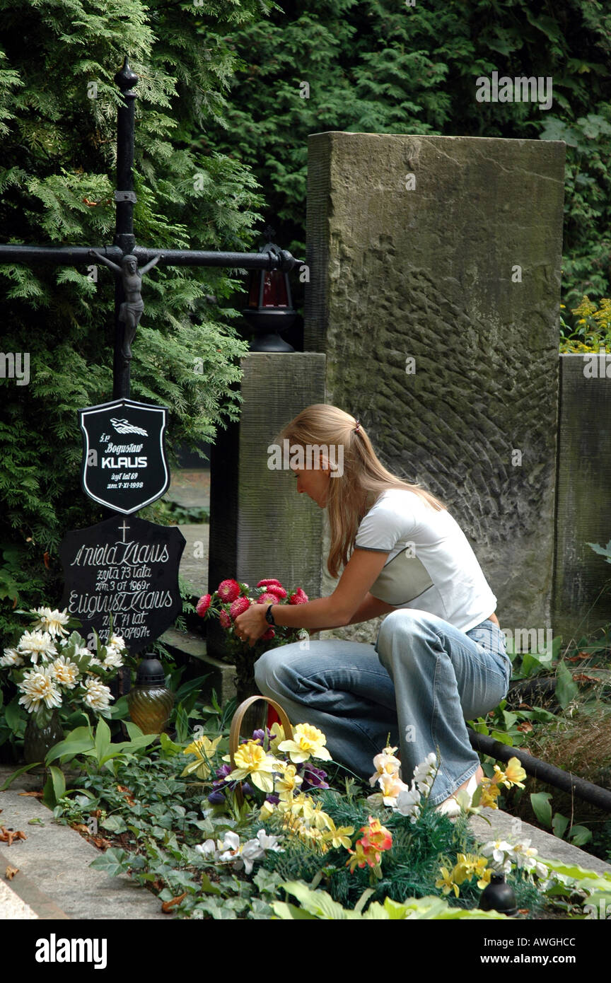 Girl visiting grave of her family members Stock Photo Alamy