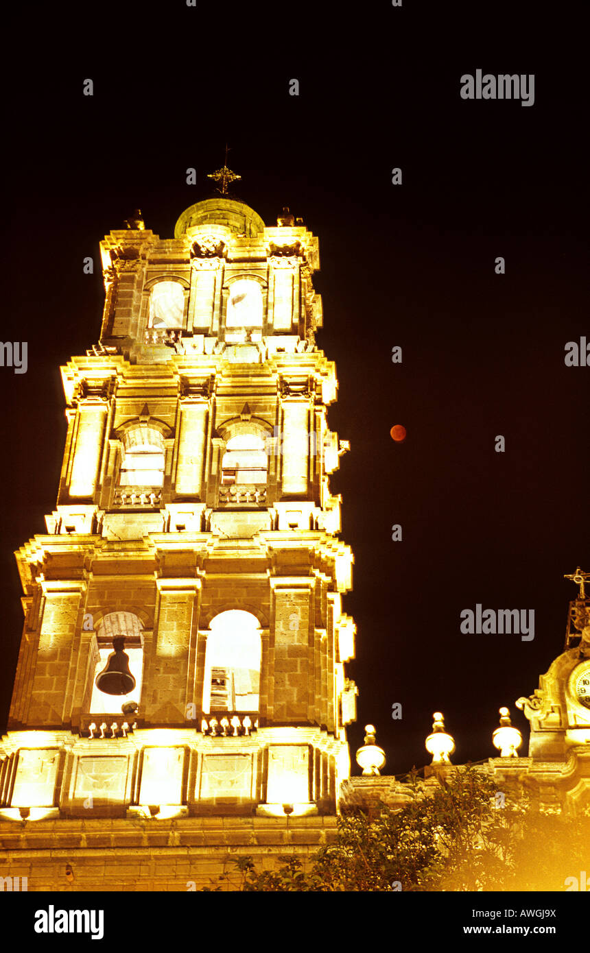 Lunar eclipse next to colonial church in the city of Morelia Michoacan Mexico Stock Photo