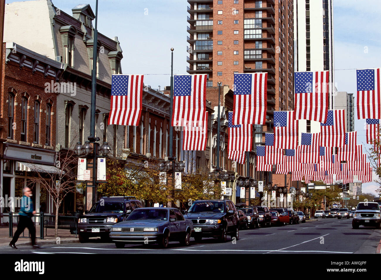 USA, Colorado, Denver, Larimer Square, United States flags strung across road above traffic Stock Photo