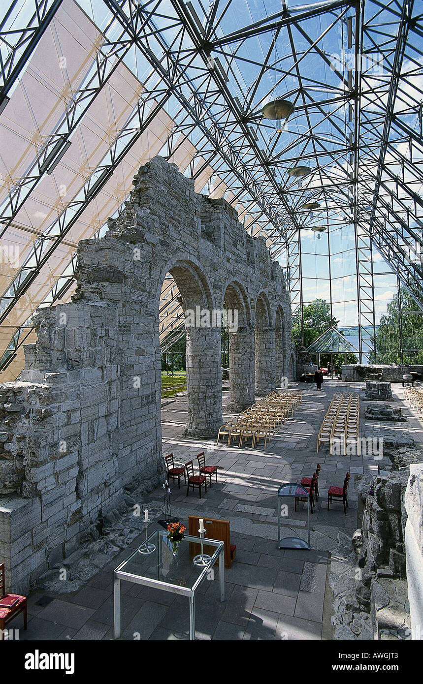 Norway, Eastern Norway, Hamar, Domkirkeruinerna, seating and altar in ruined steel dome Stock Photo