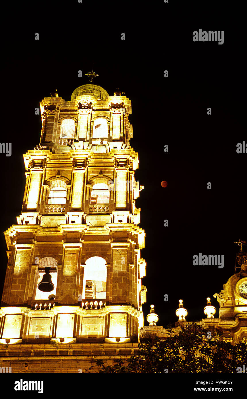 Lunar eclipse next to colonial church in the city of Morelia Michoacan Mexico Stock Photo