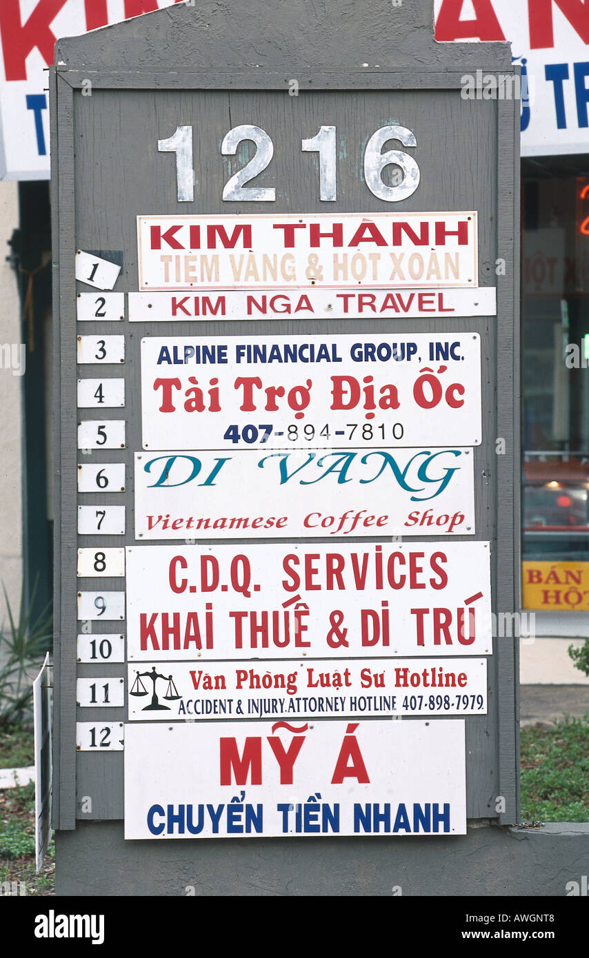 USA, Florida, Downtown Orlando, Vietnamese District, group of signs on board advertsing various business outlet in area Stock Photo