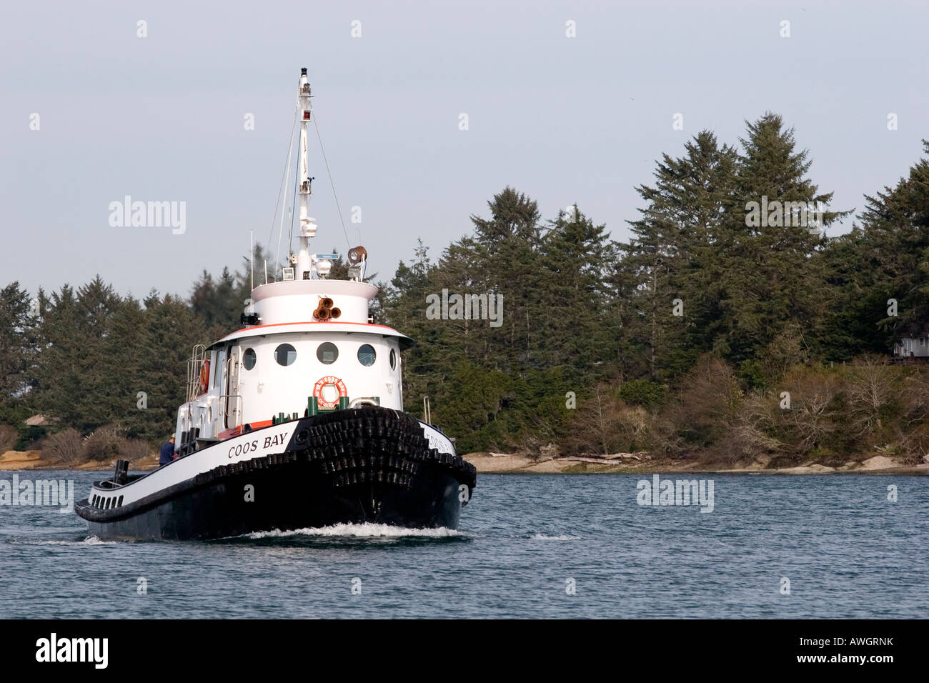 Tugboat heads for the dock in Coos Bay Oregon Stock Photo
