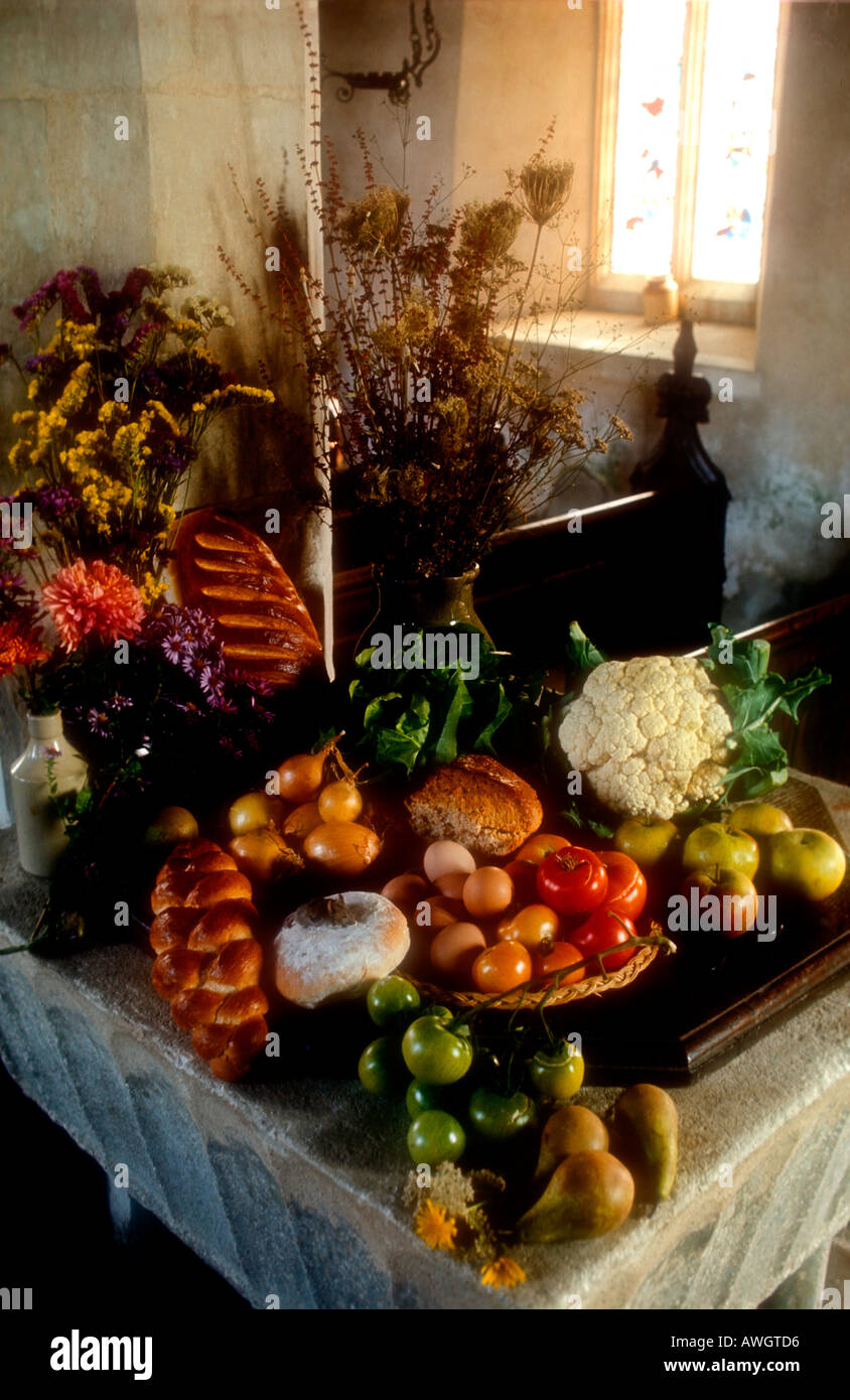 Harvest Festival display of crops and produce in Suffolk church East Anglia UK Stock Photo