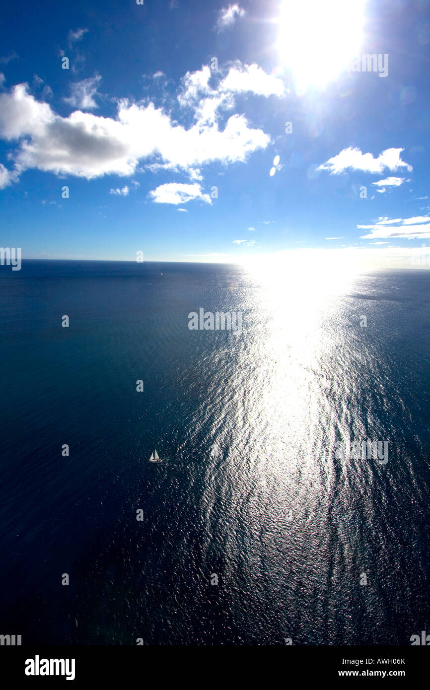 Sailboat in calm ocean Stock Photo