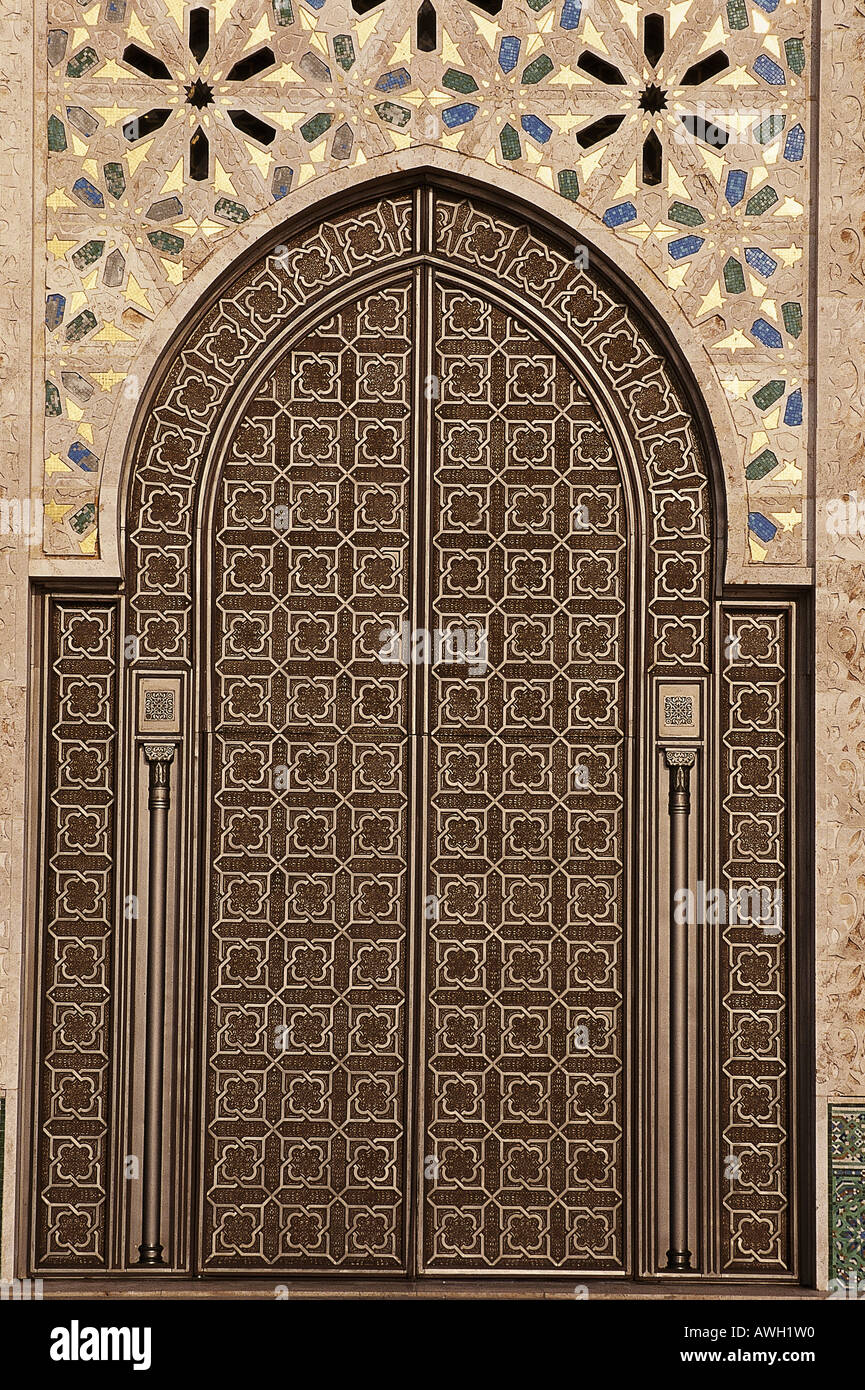 Morocco, Casablanca, Hassan II Mosque, exterior double door in shape of pointed arch framed by column Stock Photo