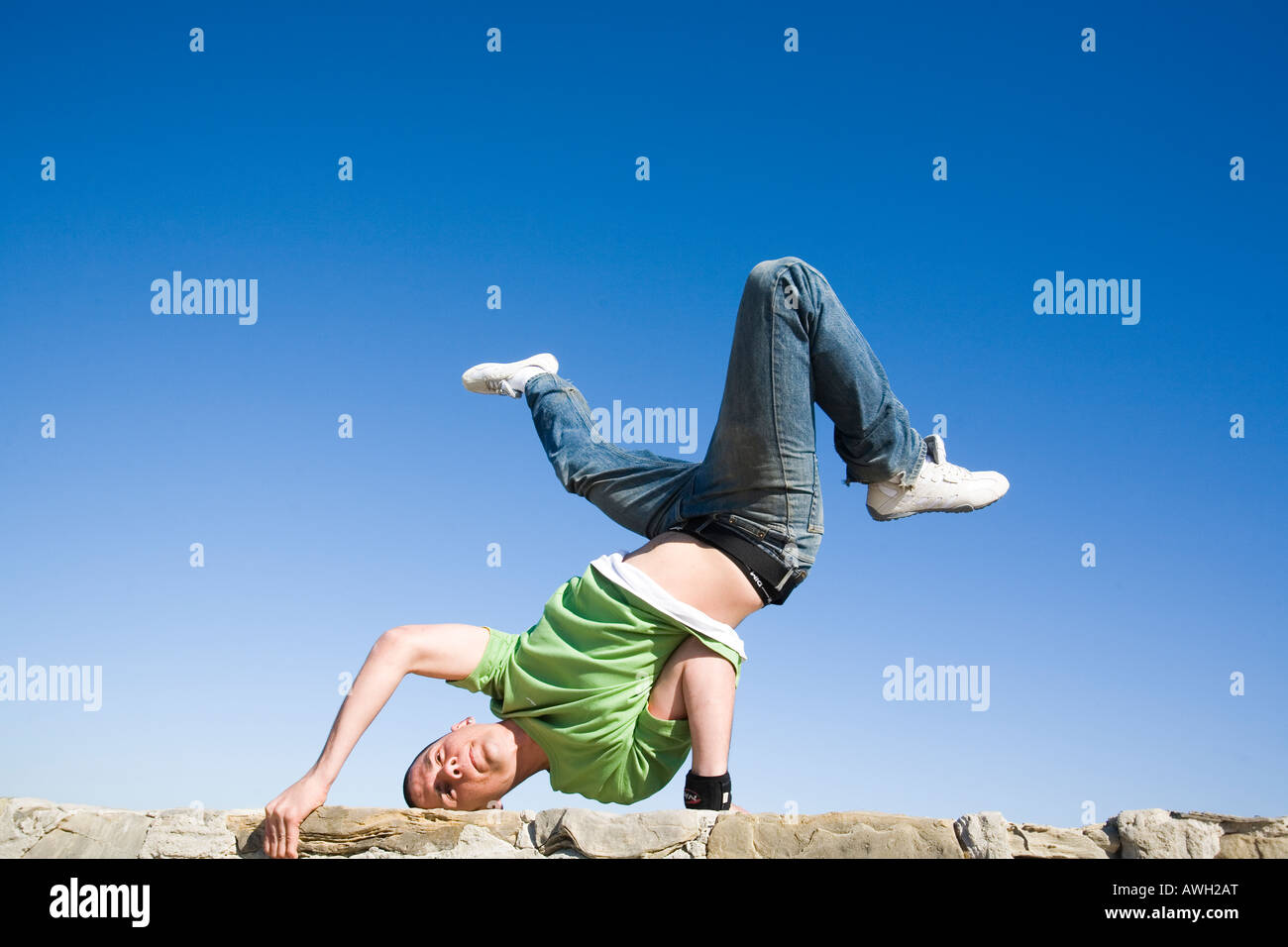 Young man in a breakdance pose Stock Photo