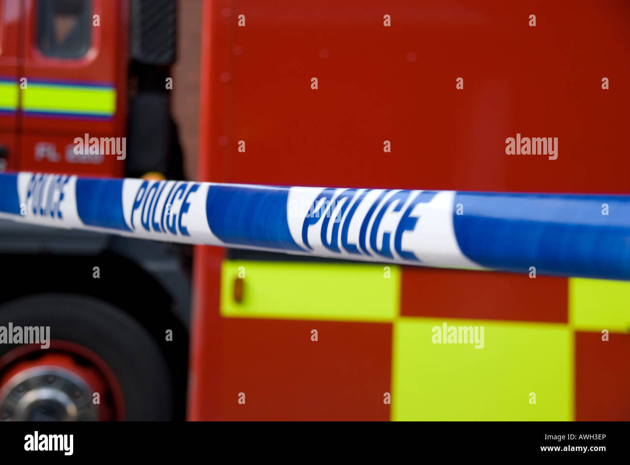 Police tape in front of fire engine Stock Photo