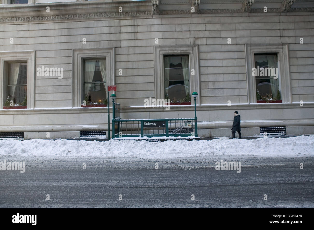 Winter view of a New York City subway station access point in a snow covered street USA January 2005 Stock Photo