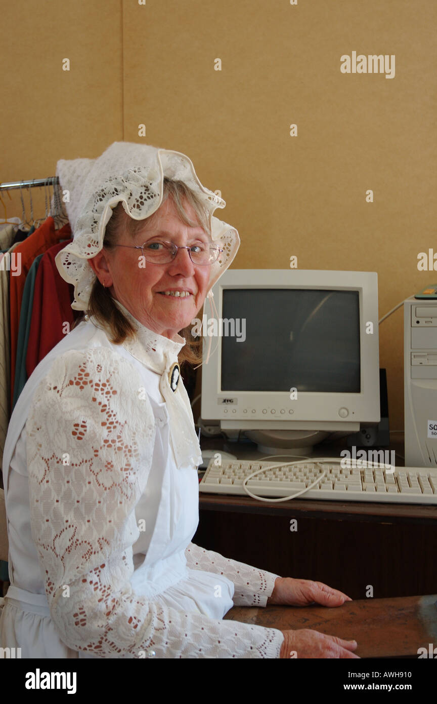 elderly woman sits at old IBM computer dsc 2669 Stock Photo