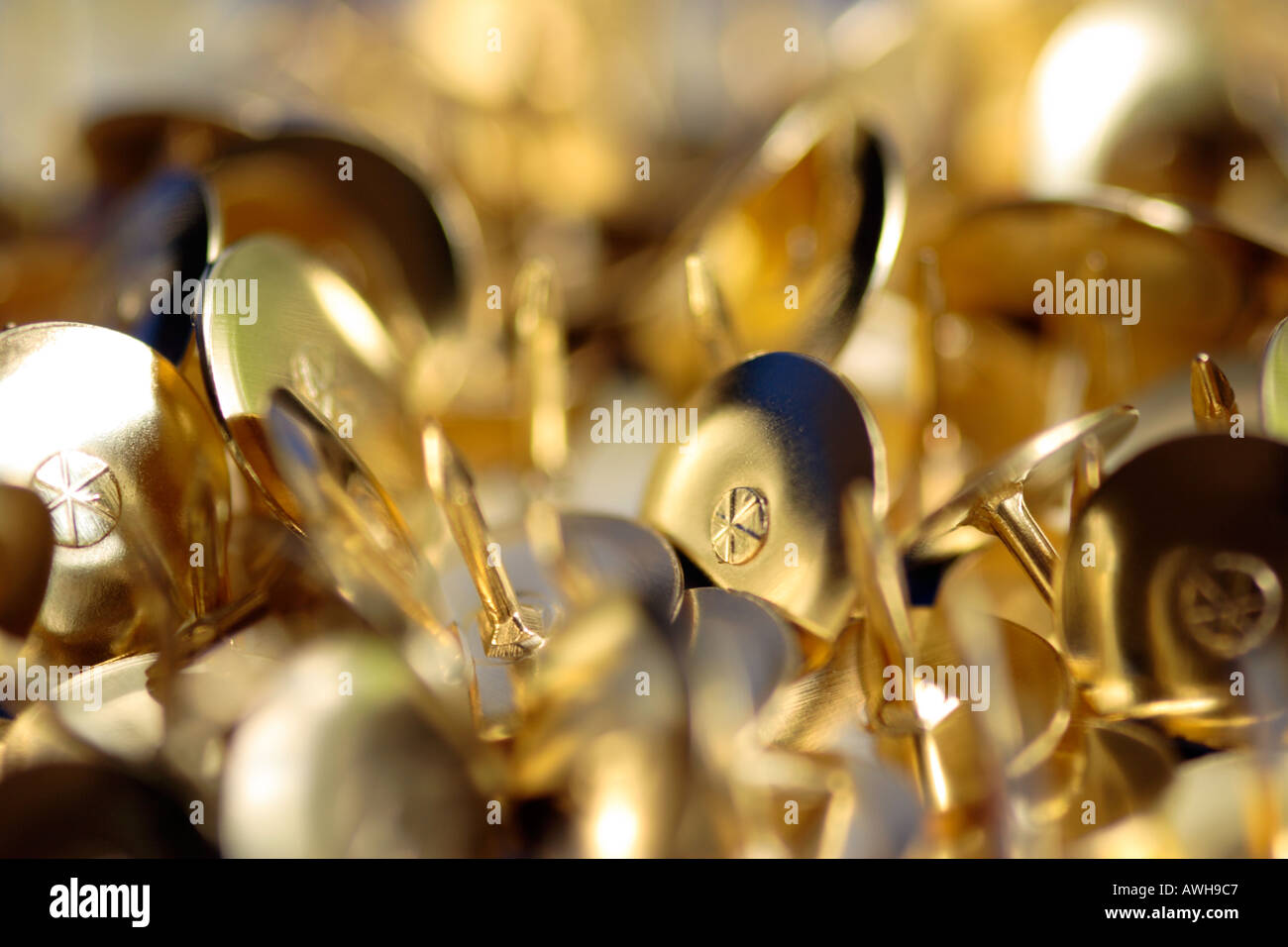Close up of gold drawing pins Stock Photo