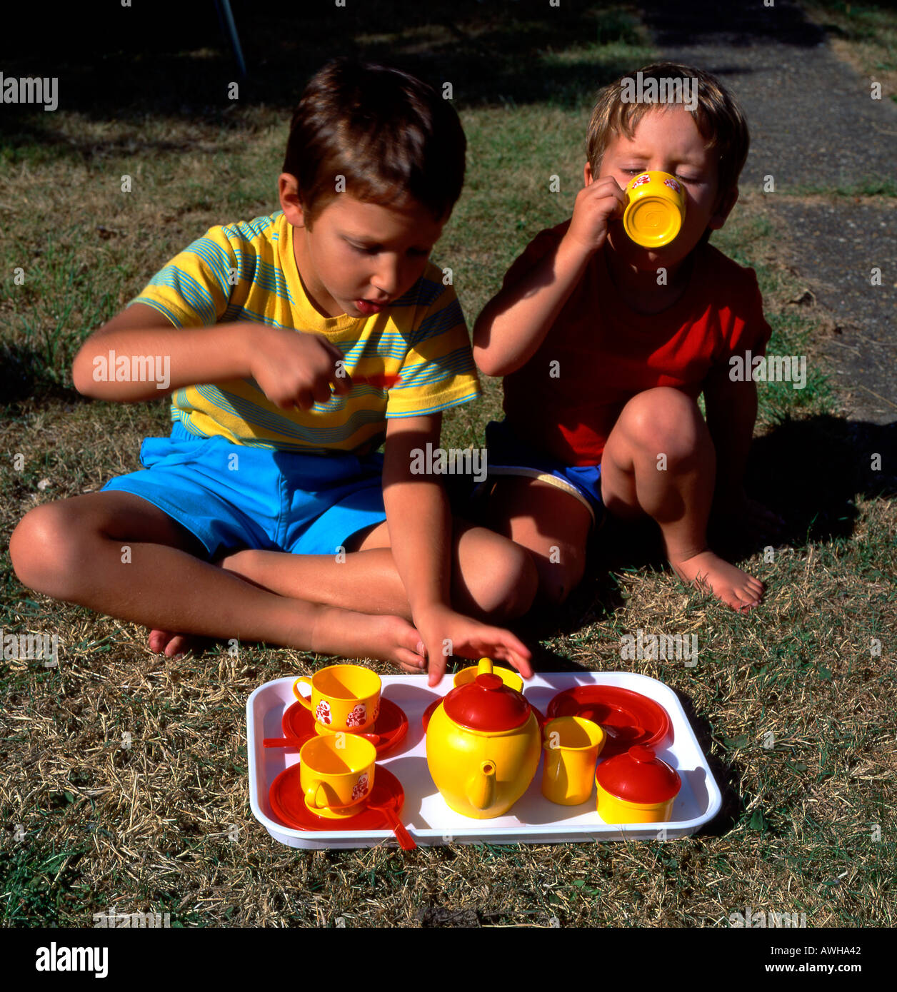 Children playing with Plastic Tea Set Stock Photo - Alamy