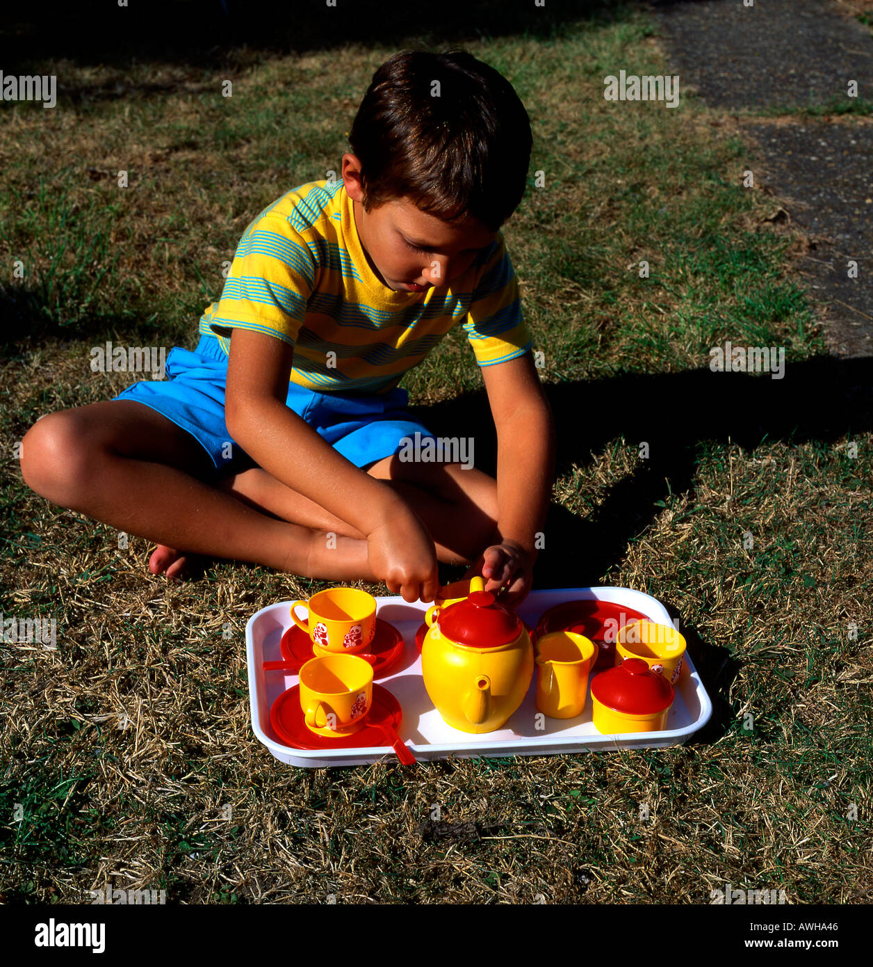 Child playing tea hi-res stock photography and images - Alamy