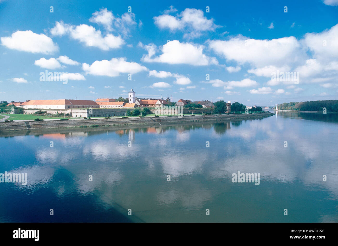 Croatia, Slavonia, Tvrda, town of Osijek and clouds reflected in water of River Drava Stock Photo