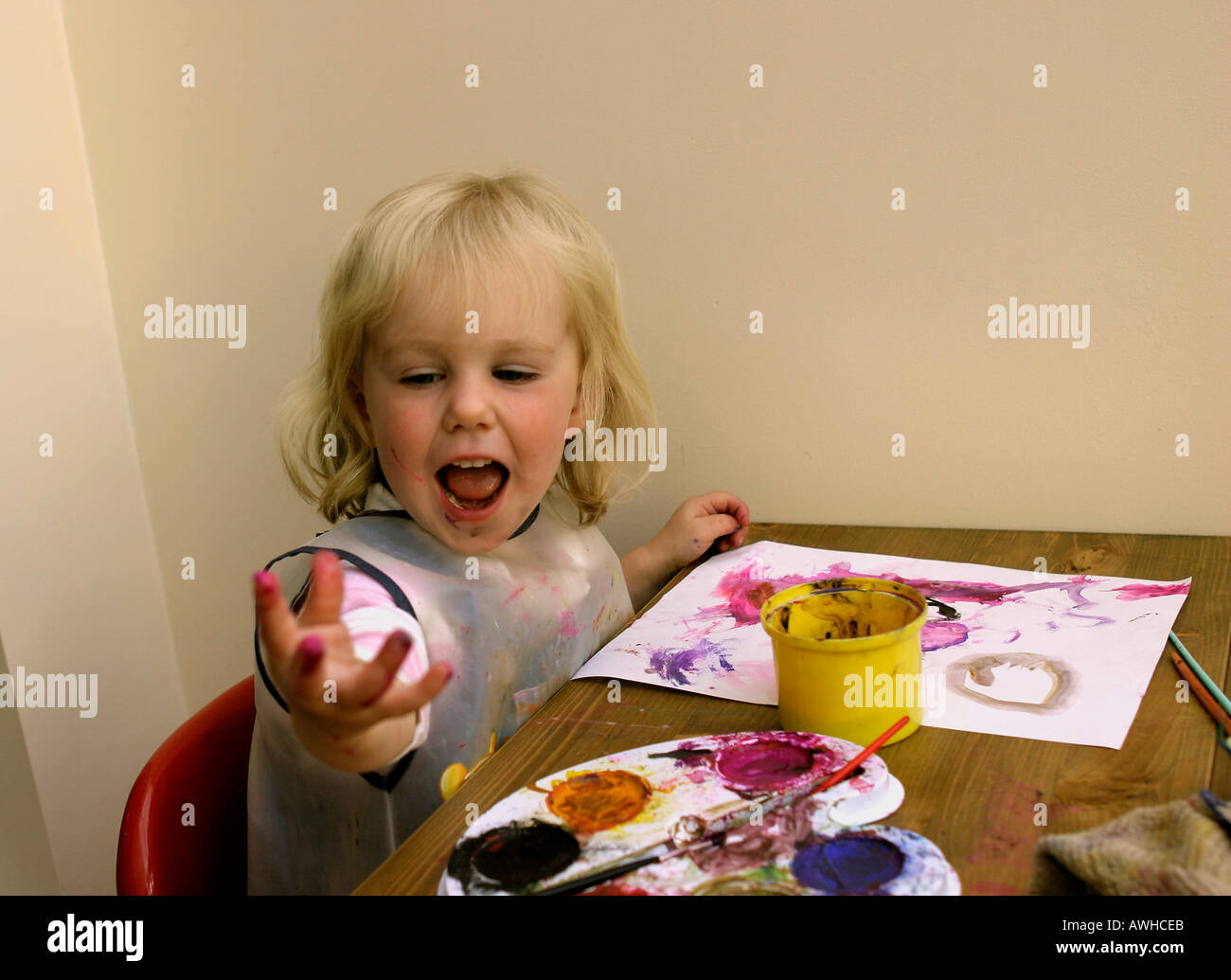 Child playing with paints Stock Photo - Alamy