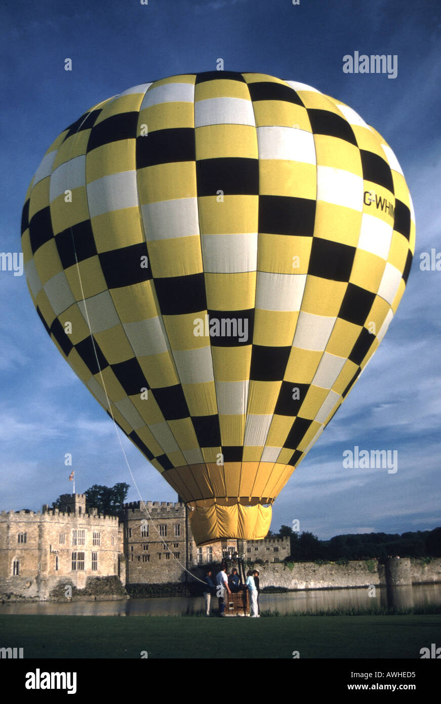 Leeds castle Kent hot air balloon flying blue sky pattern Stock Photo