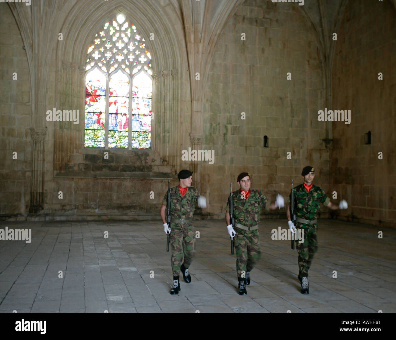 An honor guard of soldiers march in the tomb of the unknown soldier at the ornate monastery at Batalha Portugal. Stock Photo