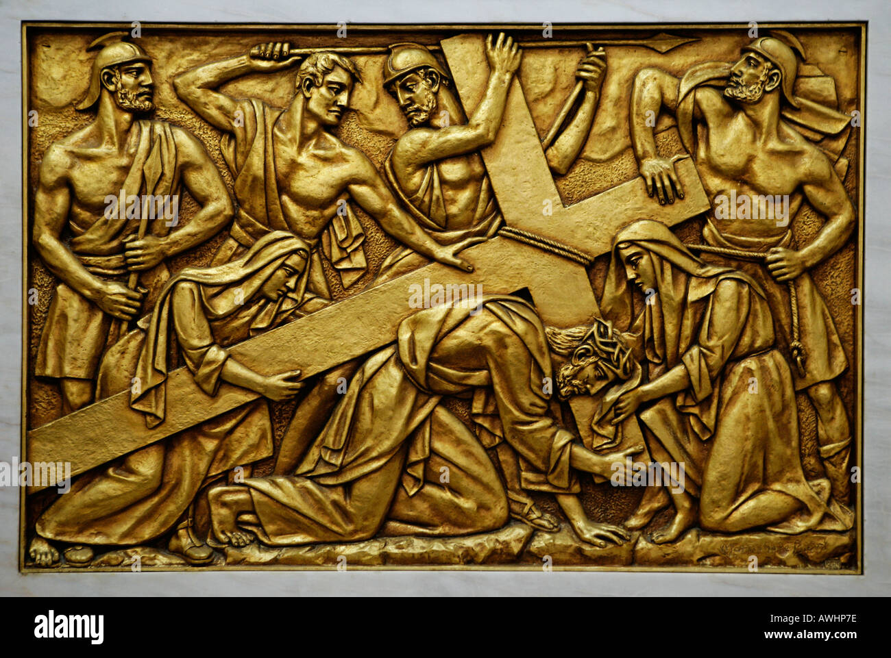 A gold plated bas relief depicting Christ carrying the cross This relief is to be found in the church at Fatima Portugal Stock Photo