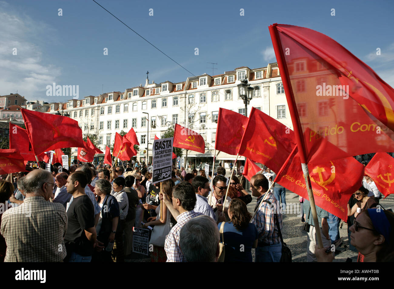The Communist Part of Portugal stages a rally with their red flags and marches into Rossio Square for speeches Stock Photo