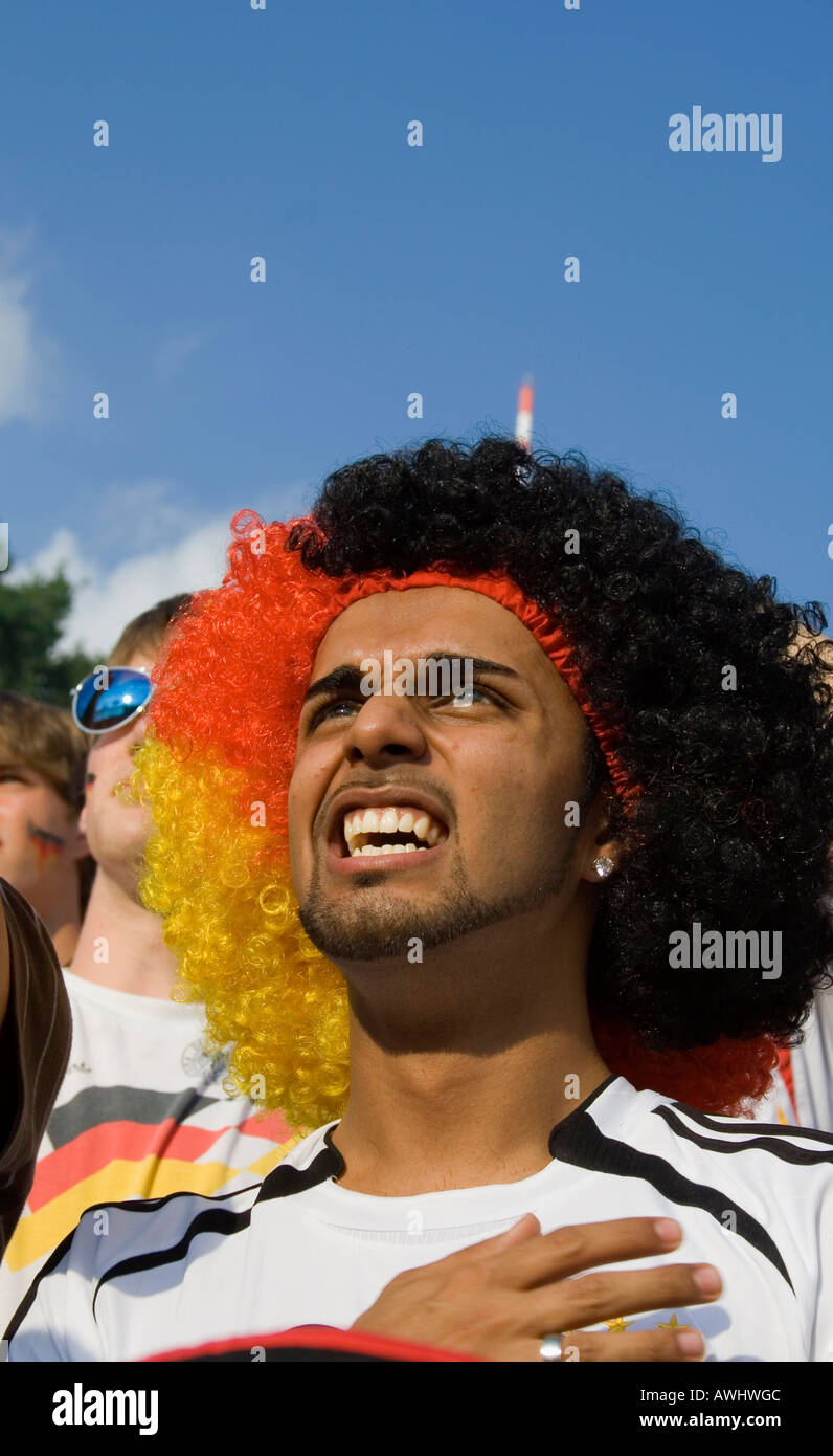 soccer fan hand on heart Stock Photo Alamy