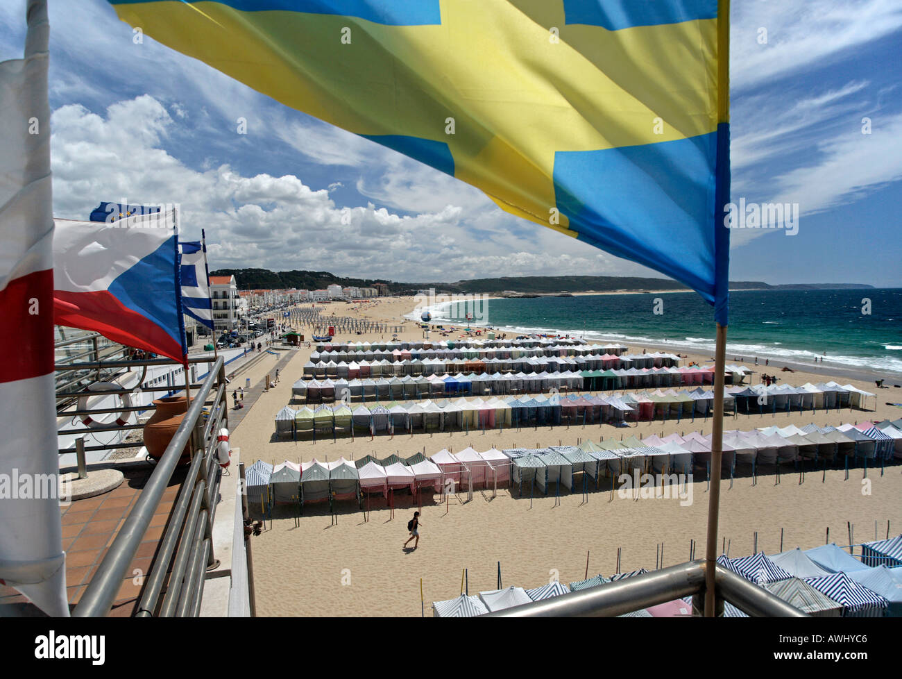 A view of the seasonal cabanas on the wide beaches at the coastal resort town of Nazaré on Portugal's Atlantic seaboard. Stock Photo